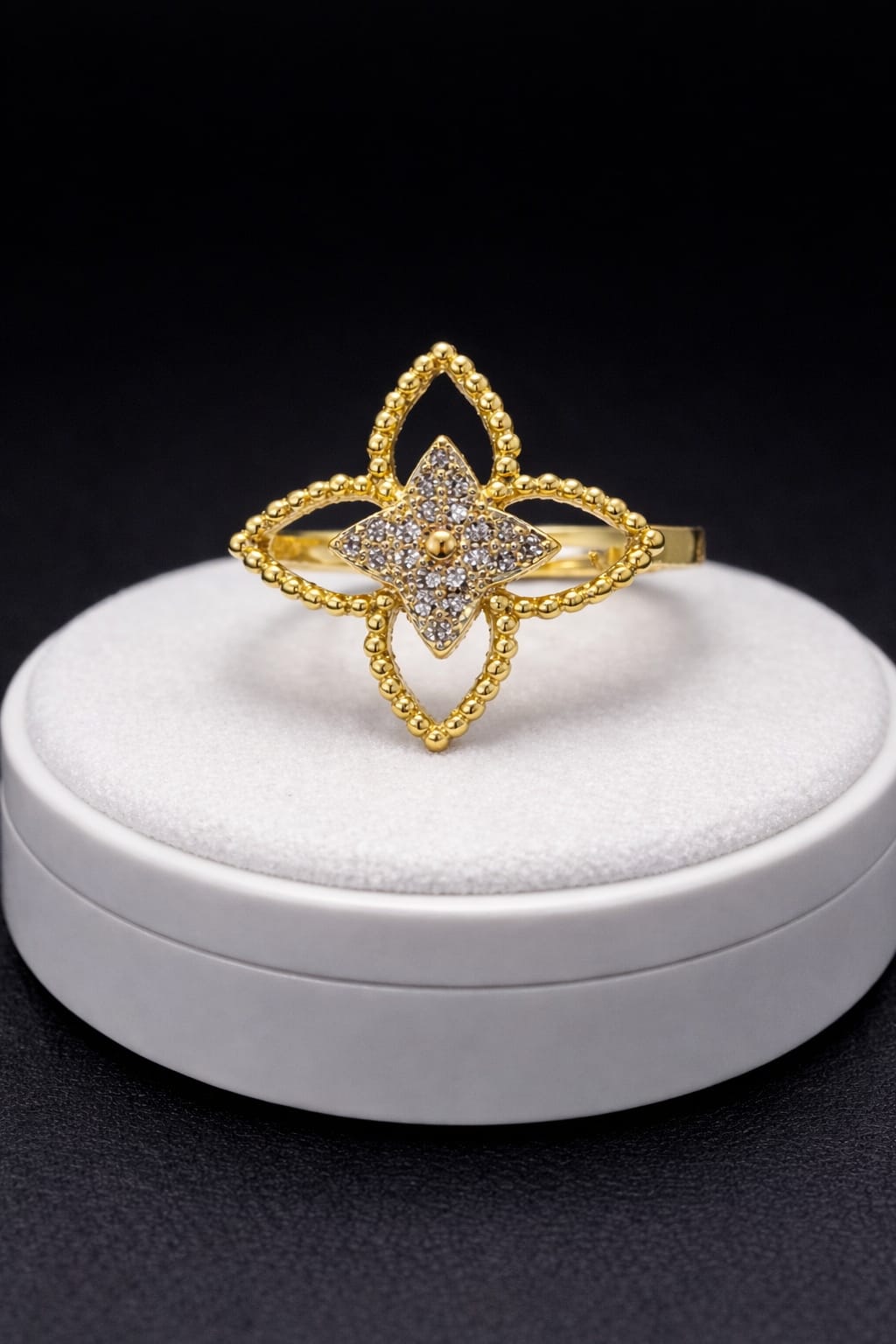 A luxurious ring with an elegant design, studded with gemstones.