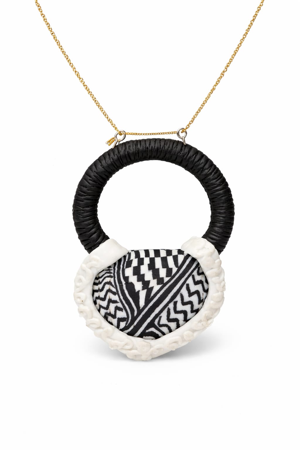 A traditional pendant inspired by the Palestinian keffiyeh.