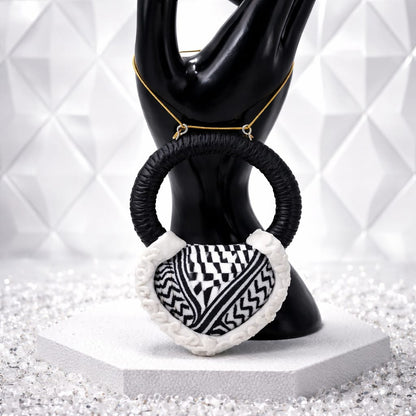 A traditional pendant inspired by the Palestinian keffiyeh.