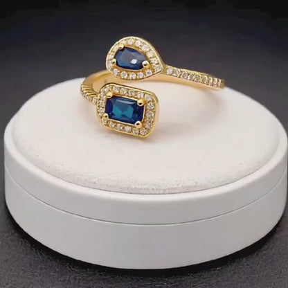 A luxurious ring with two blue stones, gold-plated 21