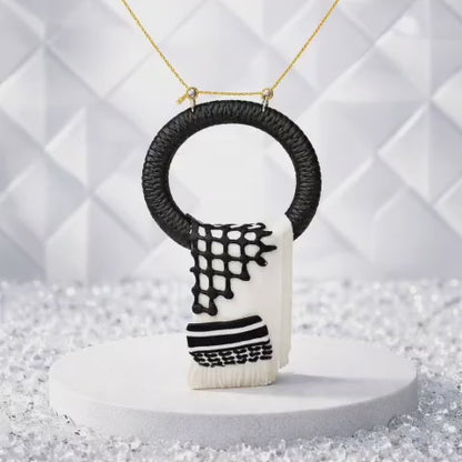 A traditional pendant inspired by the Palestinian keffiyeh.